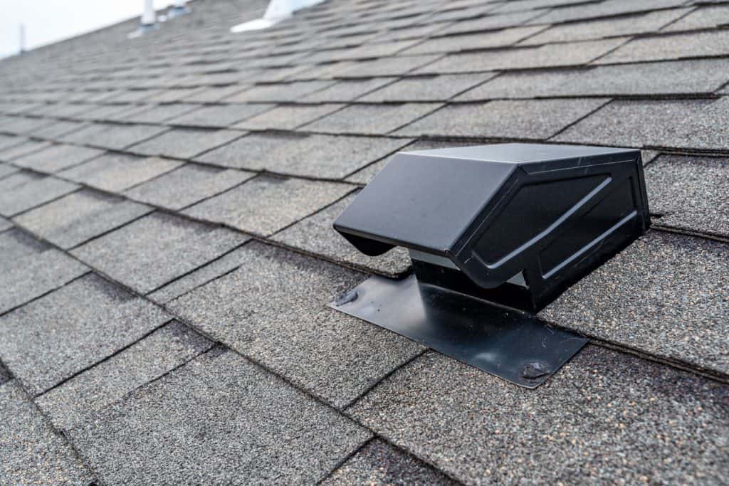 Gray shingle roofing with a black static air vent