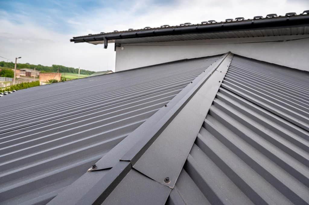 Gutter system for a metal roof
