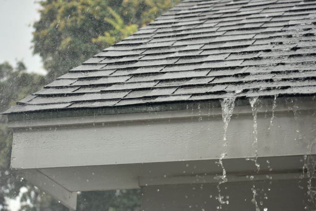 Heavy Rain Pouring down in a tile roof