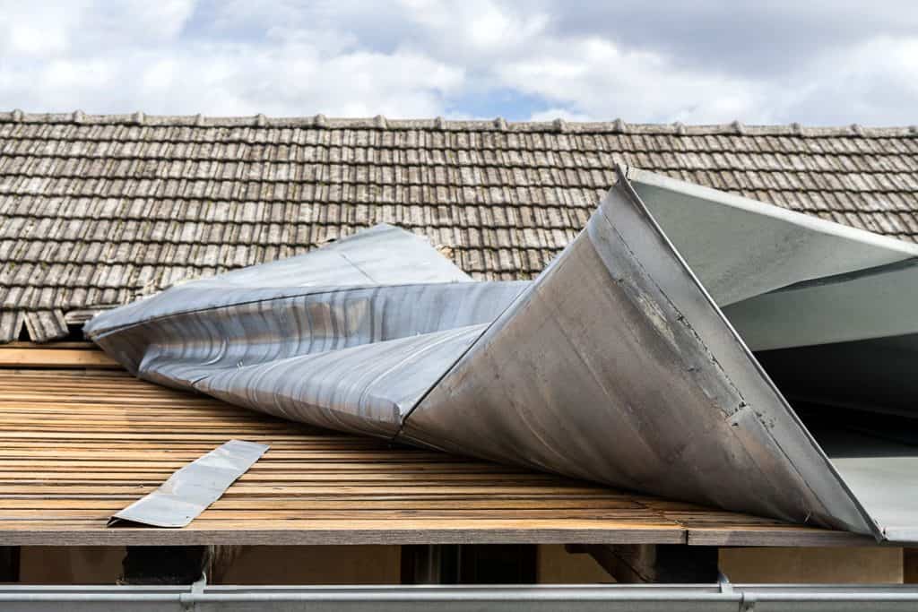 Metal roofing sheet torn away due to strong winds