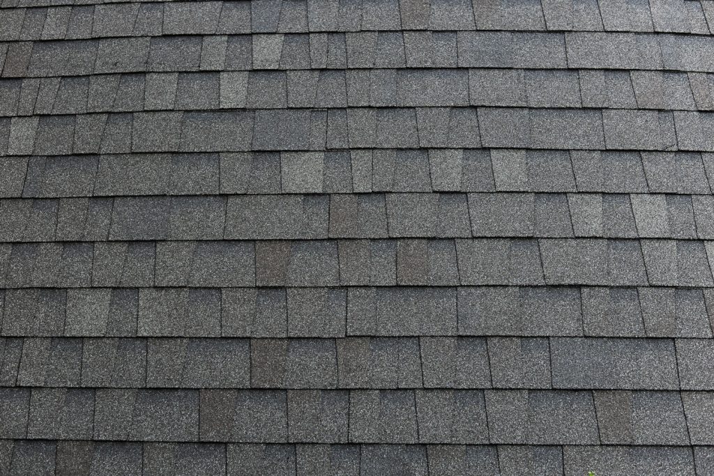 Newly installed black shingle roofing