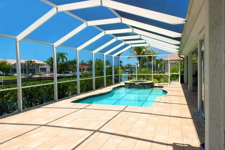 Wide angle view of screened in pool and lanai in florida, Does a lanai have a roof