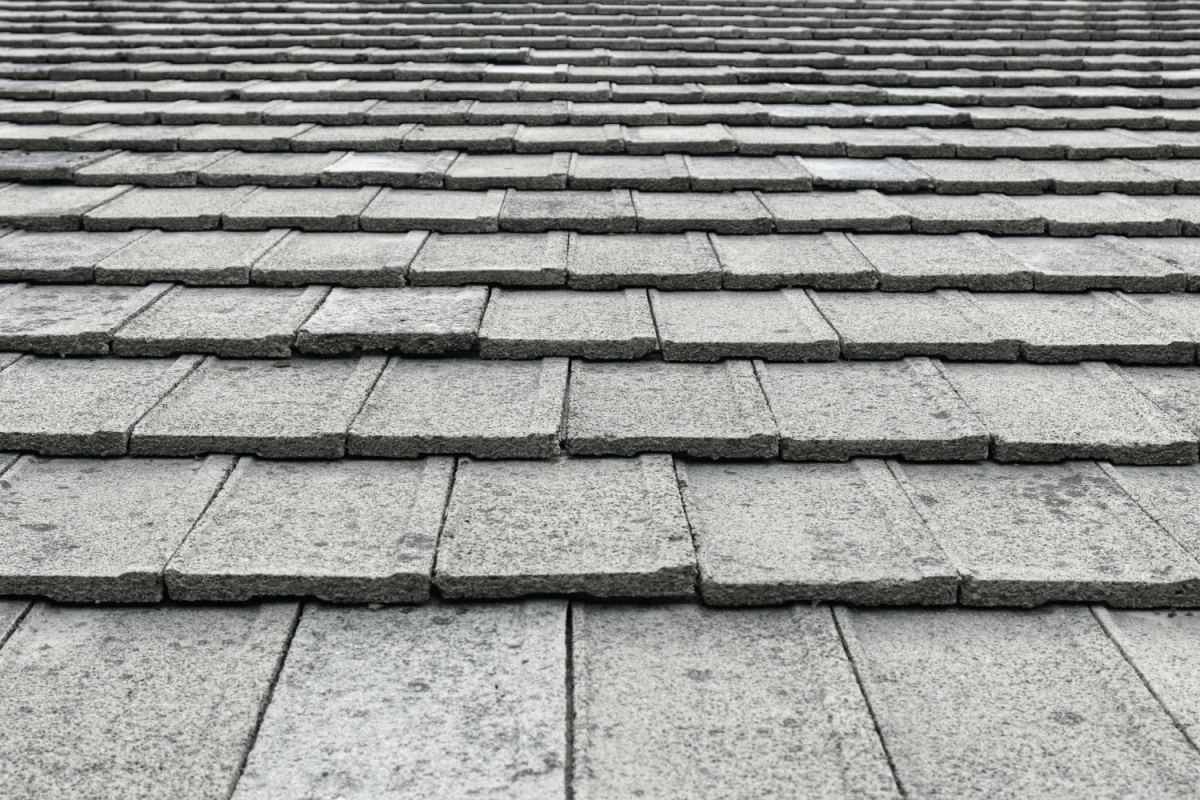 close up photo of concrete roof tiles on gray