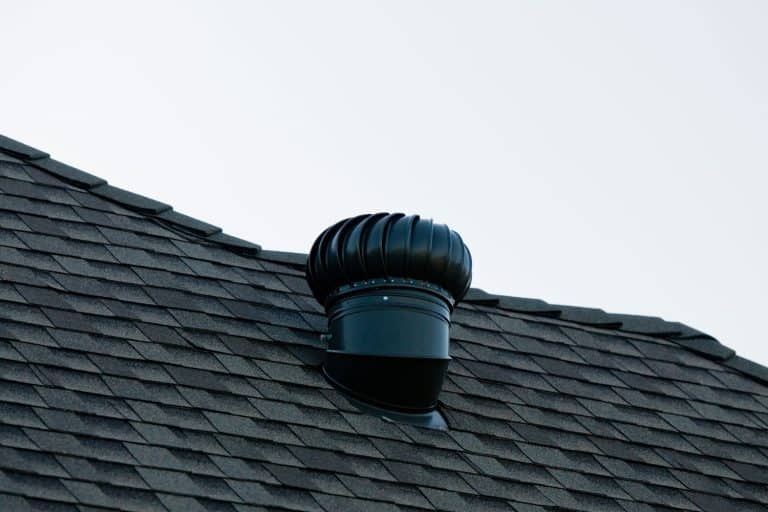 A black painted residential roof exhaust, How Many Roof Vents Do I Need in My Garage?