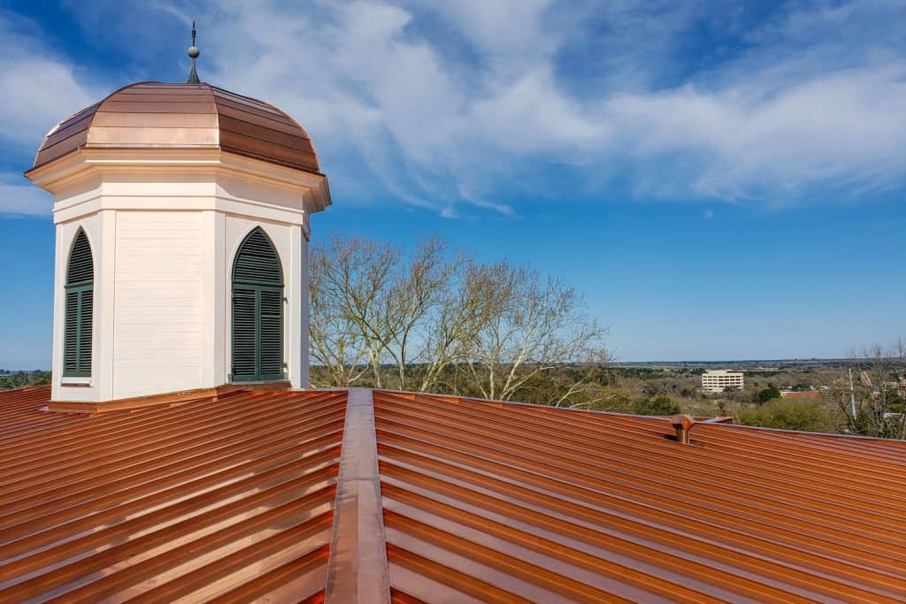 A shiny copper roof of a building