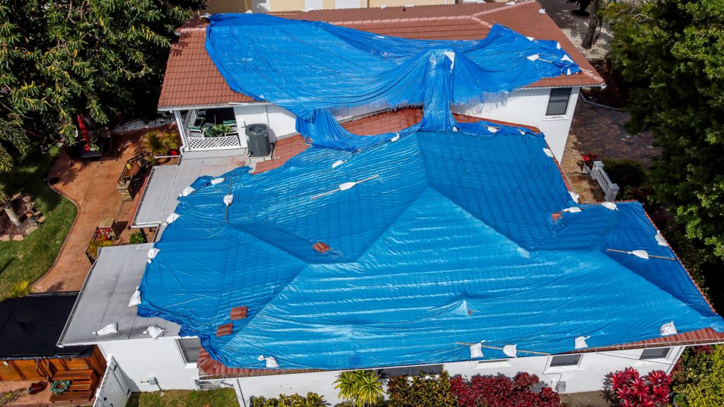 Aerial view of the blue tarp roof
