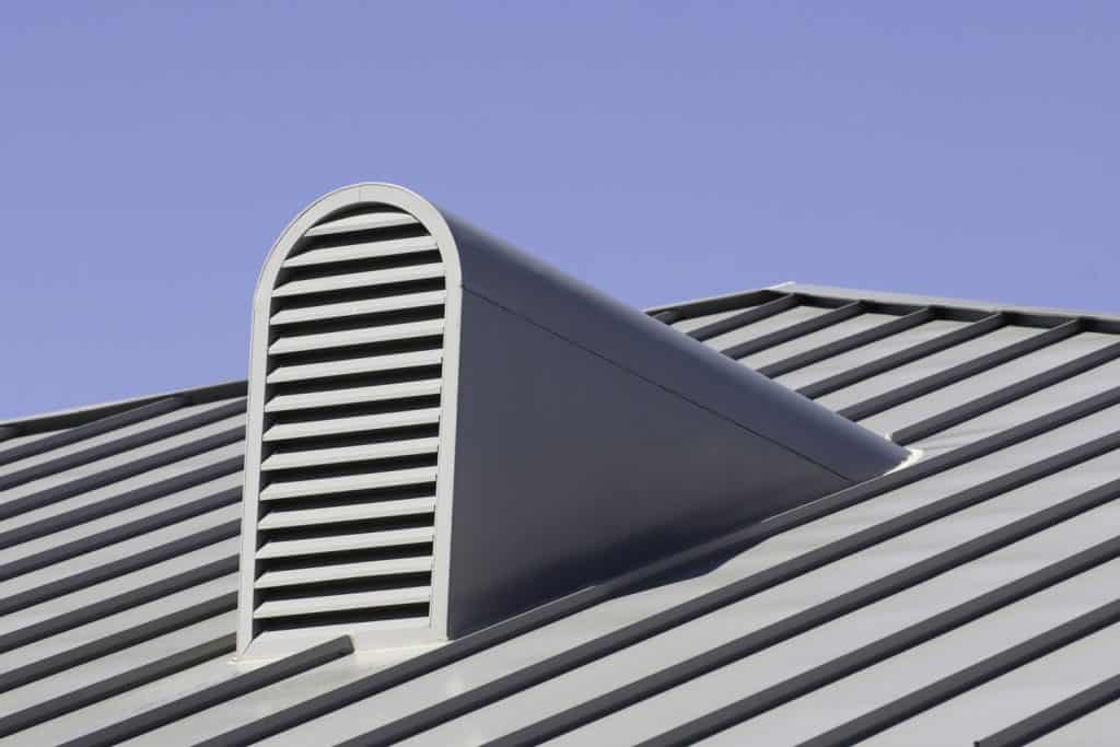 An arched metal roof vent