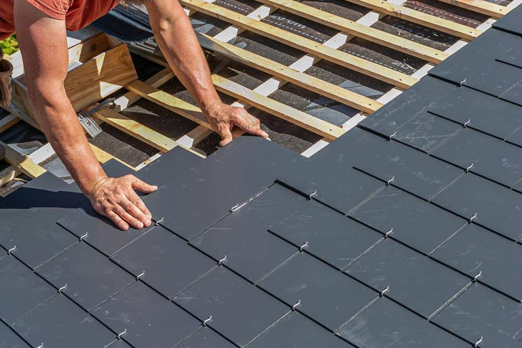 Craftsman is installing a slate roof