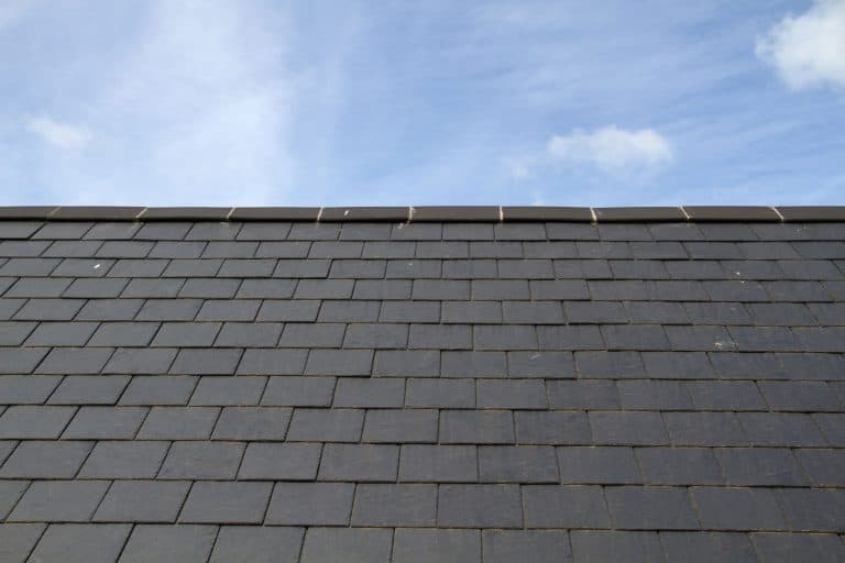 Durable and long lasting gray slate tile roofing with a ridge roll, What is A Slate Roof?