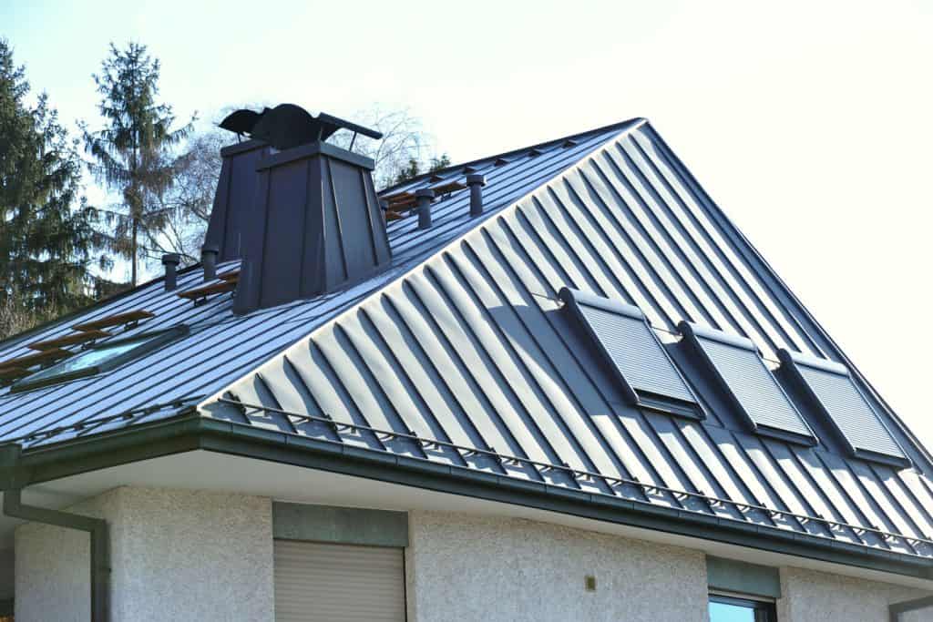 Metal roofing of a house with triangular vents