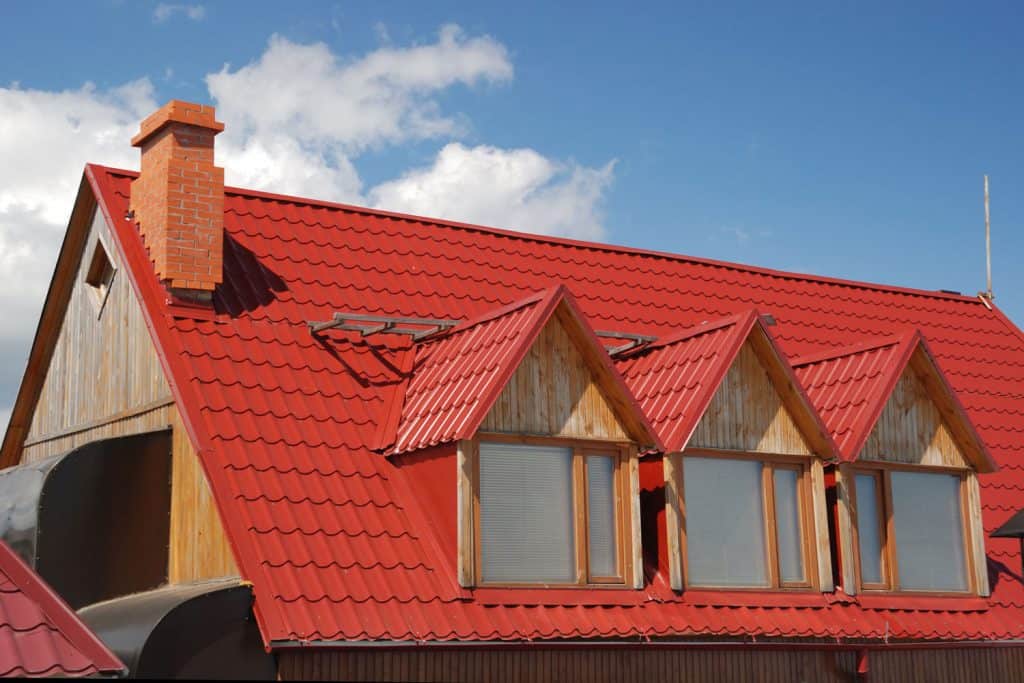 Red metal roofing for a pitched roof