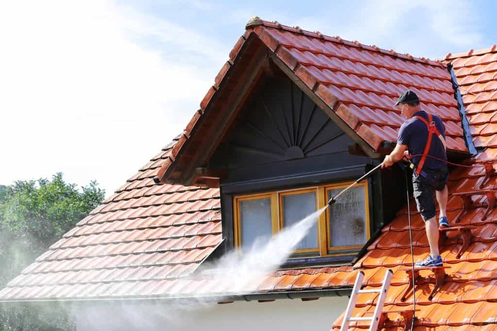 Roof cleaning with high pressure cleaner