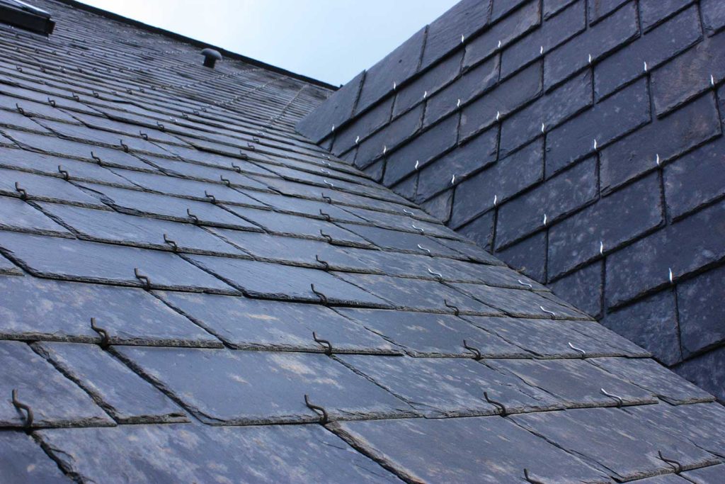 Roof of house in slate tiles