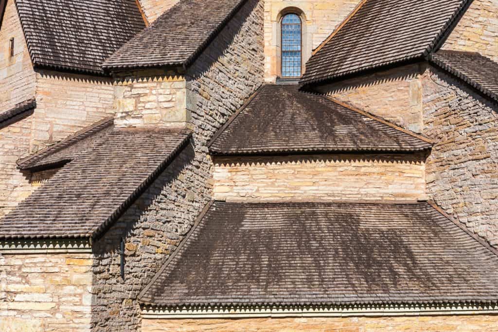 Roofing style on abbey church with wood shingles attached as roof