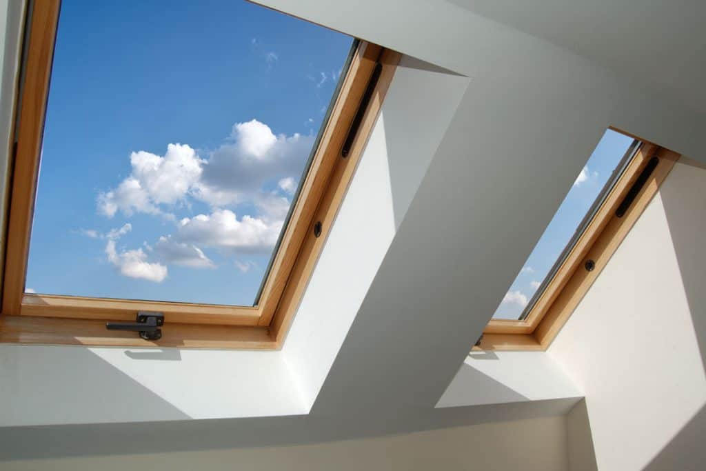 skylight windows, blue sky with perfect view of puffy white clouds