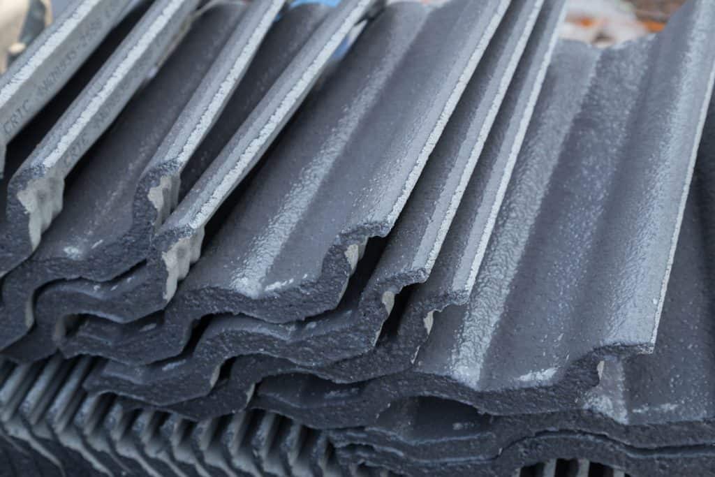 stack of new concrete roof tile gray color at construction site