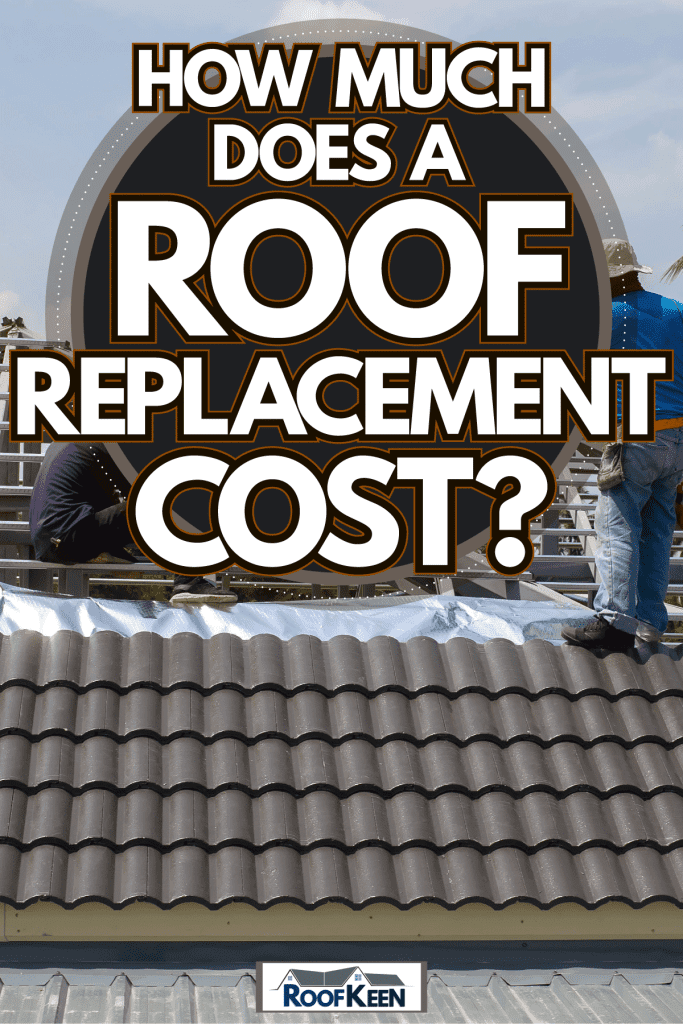Roofers installing new clay tile roofing for a house under construction, How Much Does A Roof Replacement Cost?