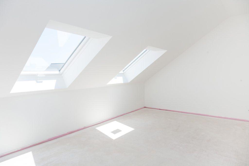 a clean, bright, attic with two windows