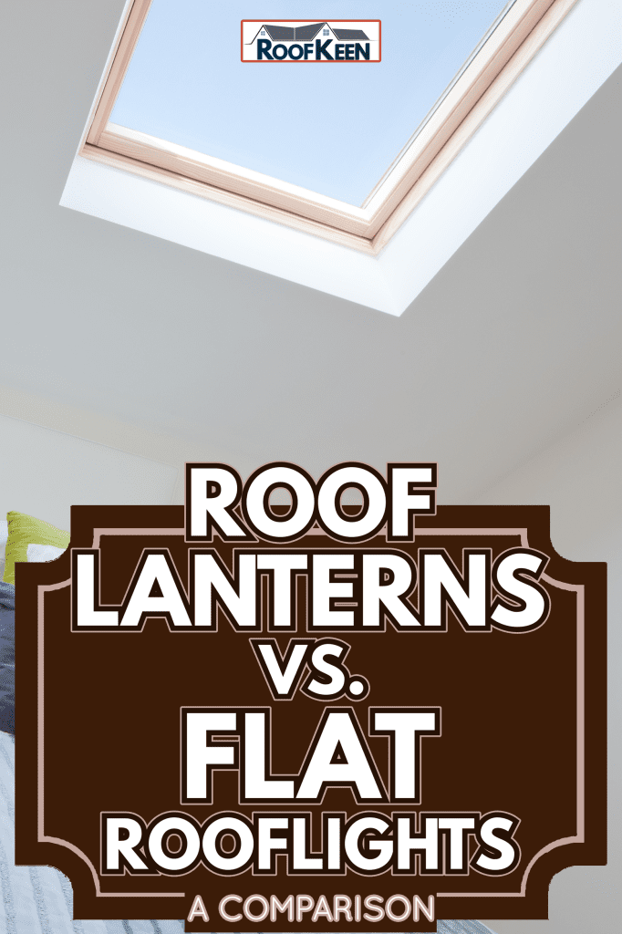 Stylish modern loft bedroom with rooflights and bed dressed with brightly coloured fashionable fabrics - Roof Lanterns vs. Flat Rooflights A Comparison