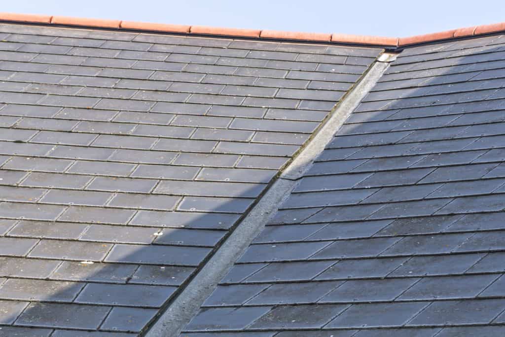 View of a roof showing the lead valley and roof slates.

